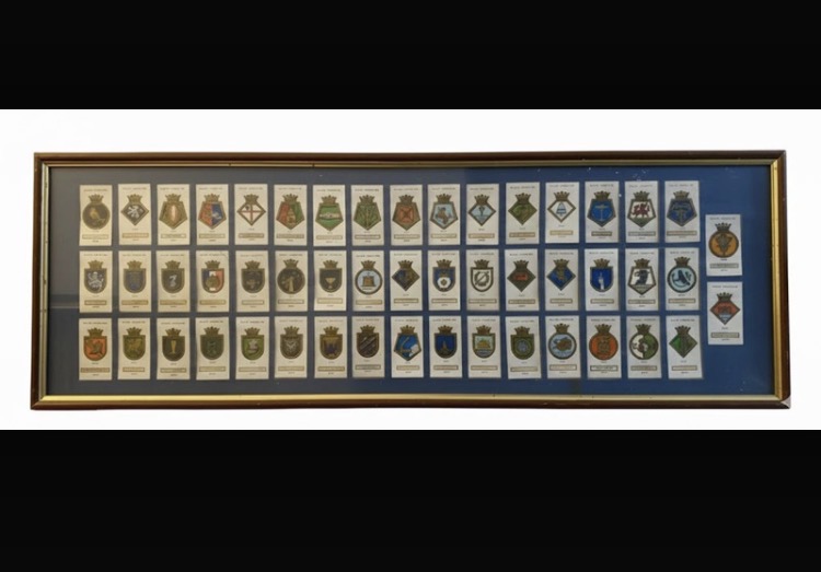 Lot 147: Framed 1925 W.D. & H.O. Wills Cigarette Cards — Ships' Badges Full Set